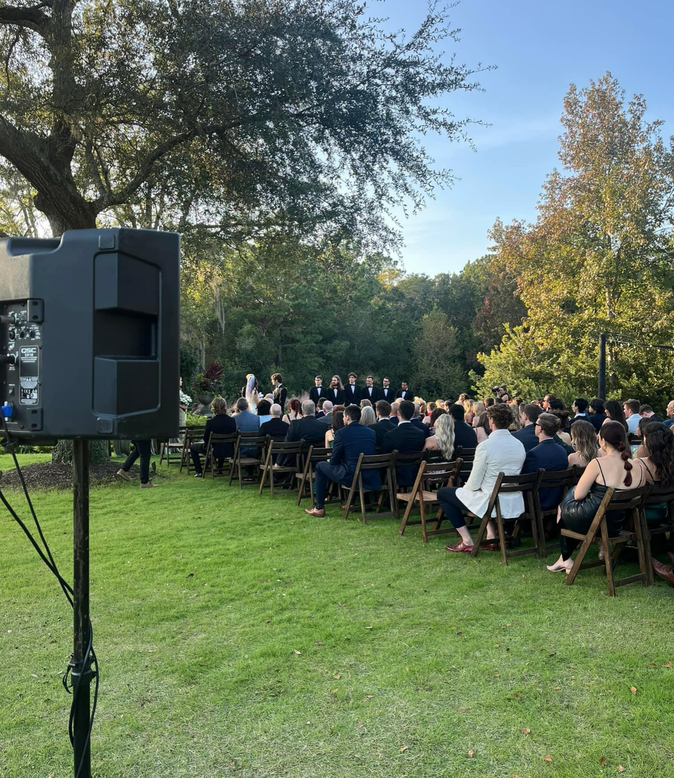 Professional ceremony audio setup at outdoor wedding