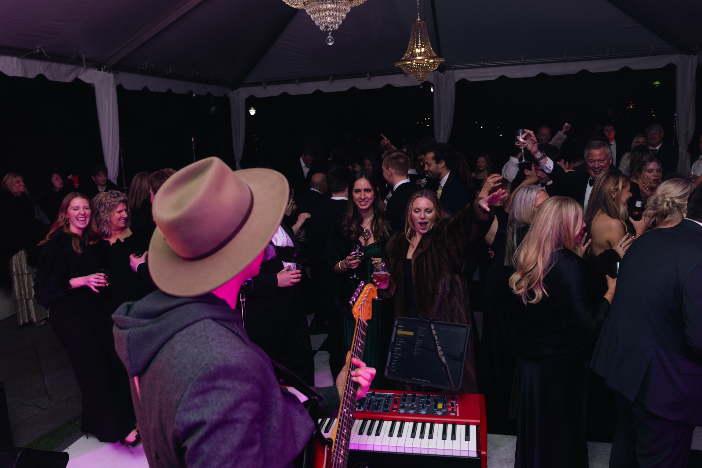Wedding guests dancing to live music